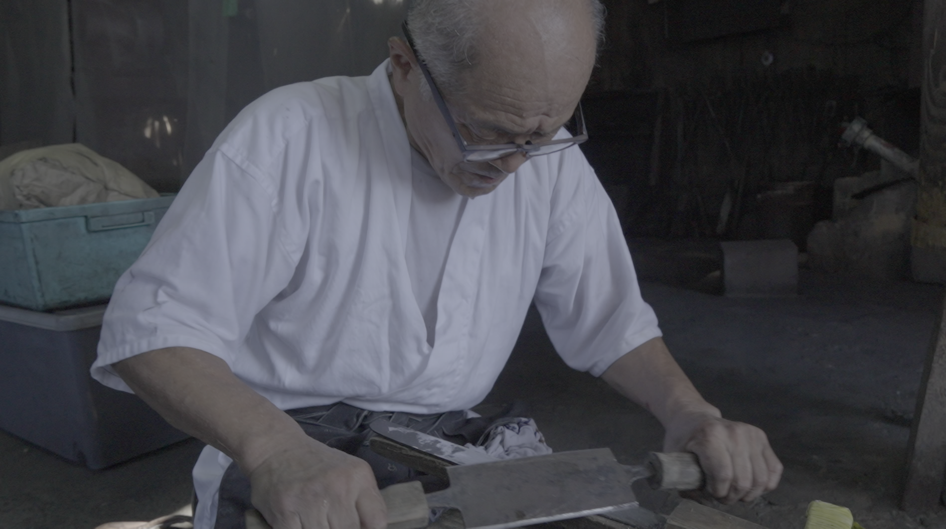 A sword polisher concentrating on his work