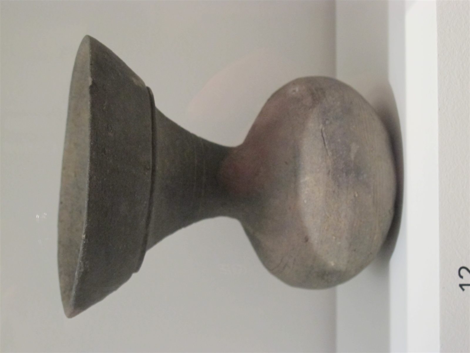 Sixth-century Kofun-period Sue ware vessel with a large rim and foot
